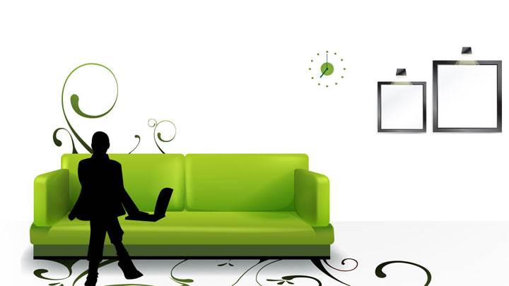 A Man Is Sitting On A Green Sofa